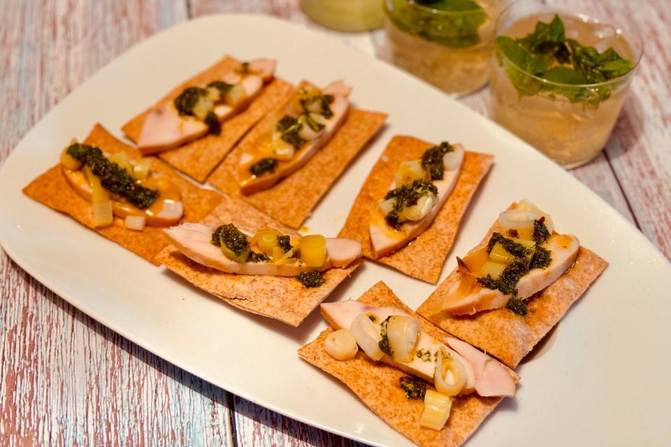 Crisp breads with smoked chicken, leeks and zhoug