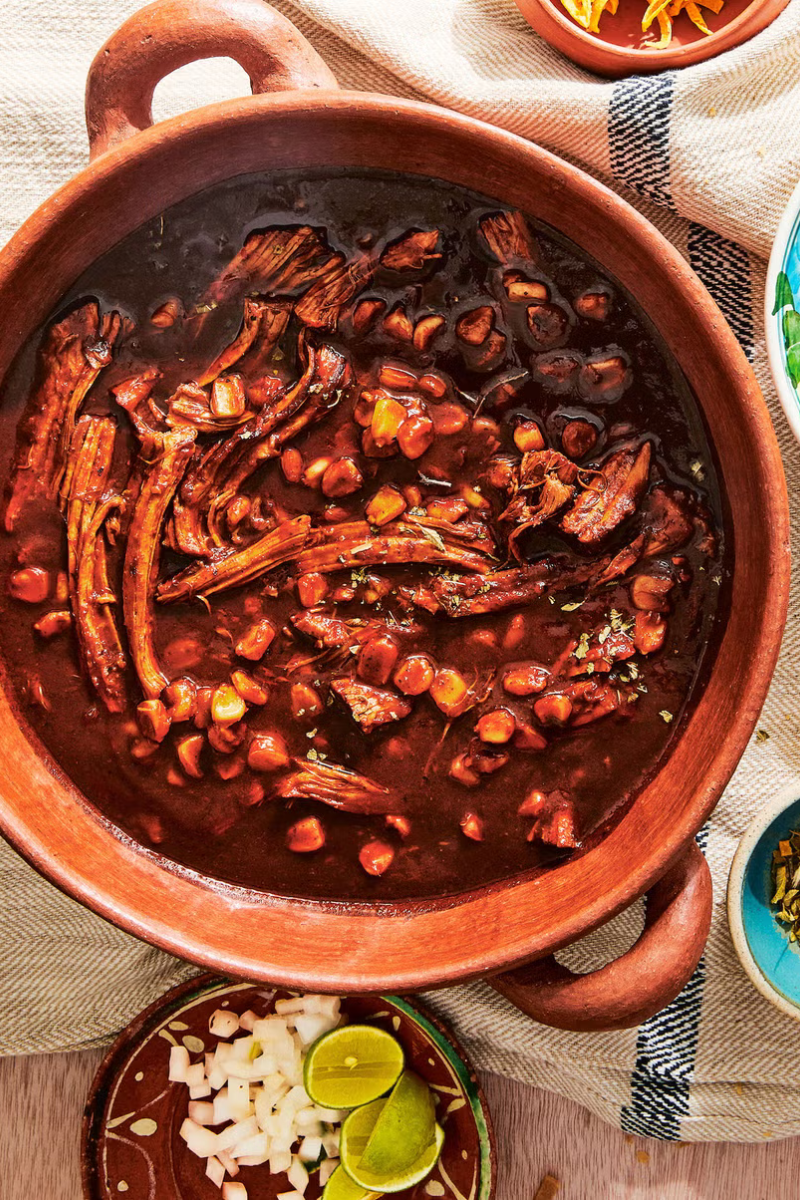 pozole rojo soup in a clay pot
