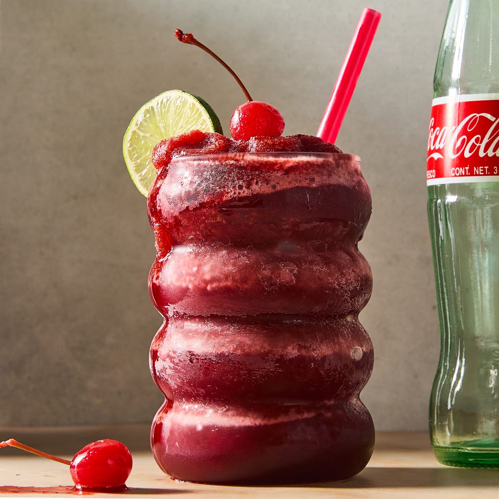 Frozen Cherry Coke Slushies cherry coke blended frozen slushies topped with a lime wedge and maraschino cherry