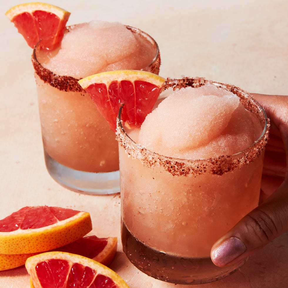 Frozen Palmoa frosty blended pink drink with a grapefruit wedge