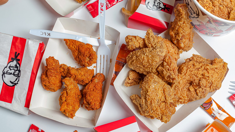 KFC Extra Crispy Chicken and Original Fried Chicken on a white table.