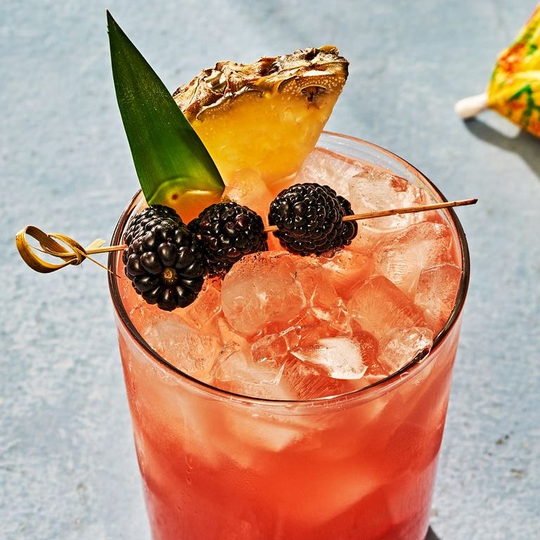 Rum Runner rum runner garnished with blackberries and pineapple