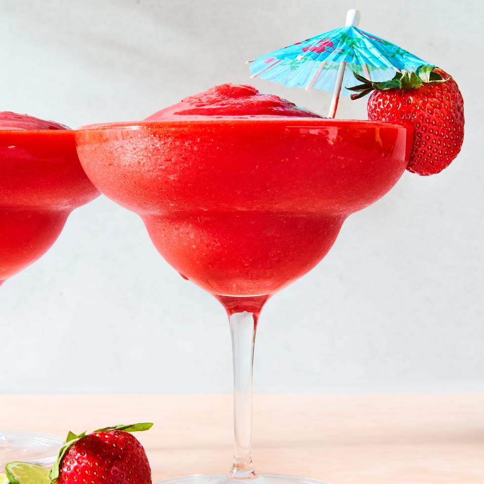 Strawberry Daiquiri strawberry daiquiri in a glass with a beach umbrella