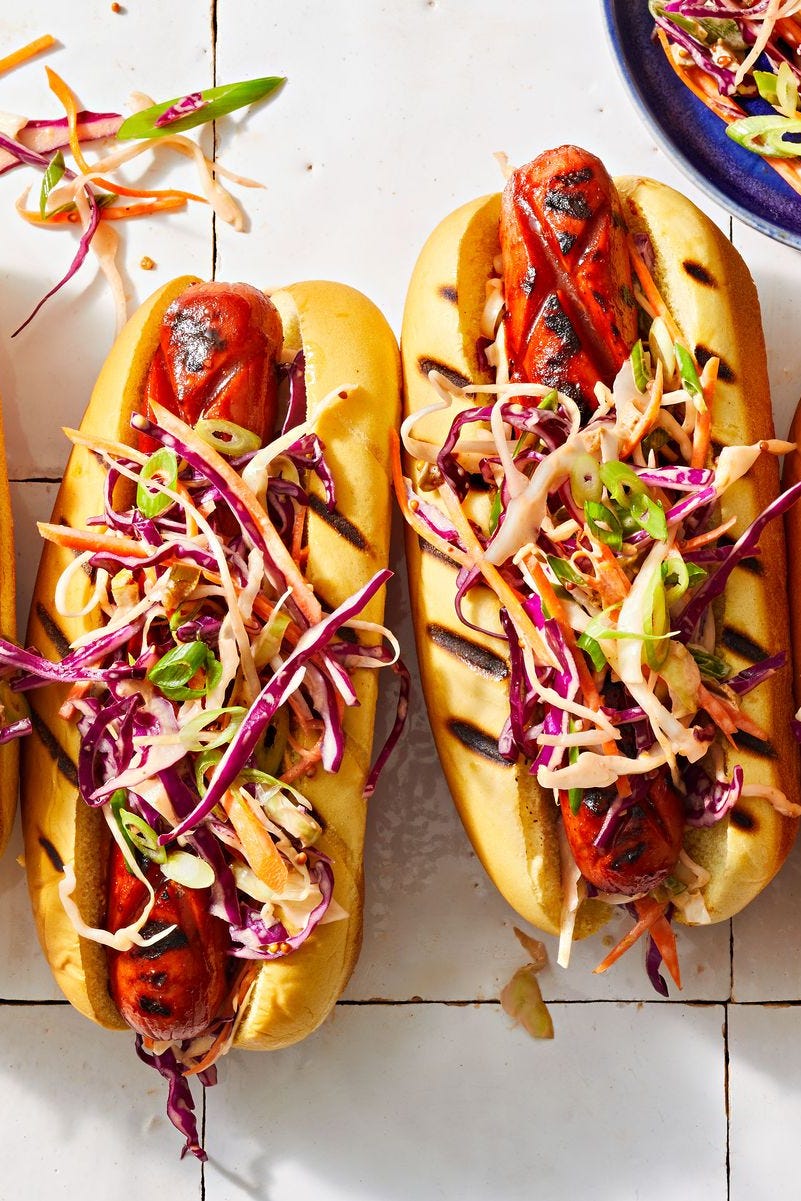 bbq glazed hot dogs with coleslaw on top
