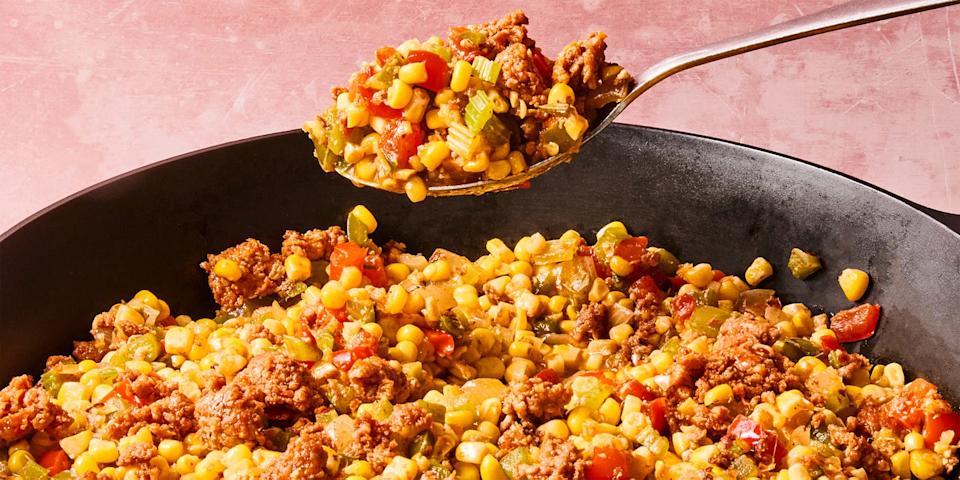 sausage, corn, and peppers in a skillet