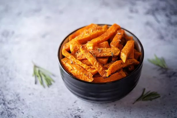 Sweet potato fry fries with sauce. toning. selective focus