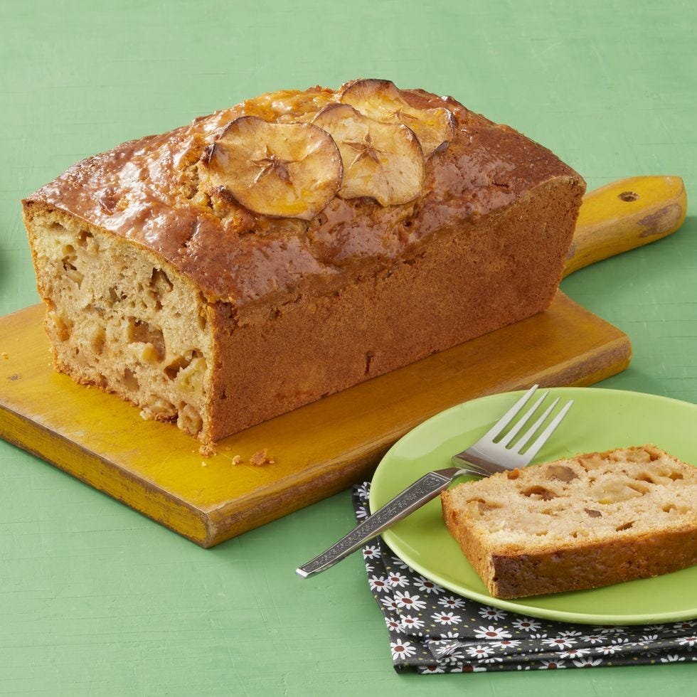 apple cinnamon bread green background on wood board