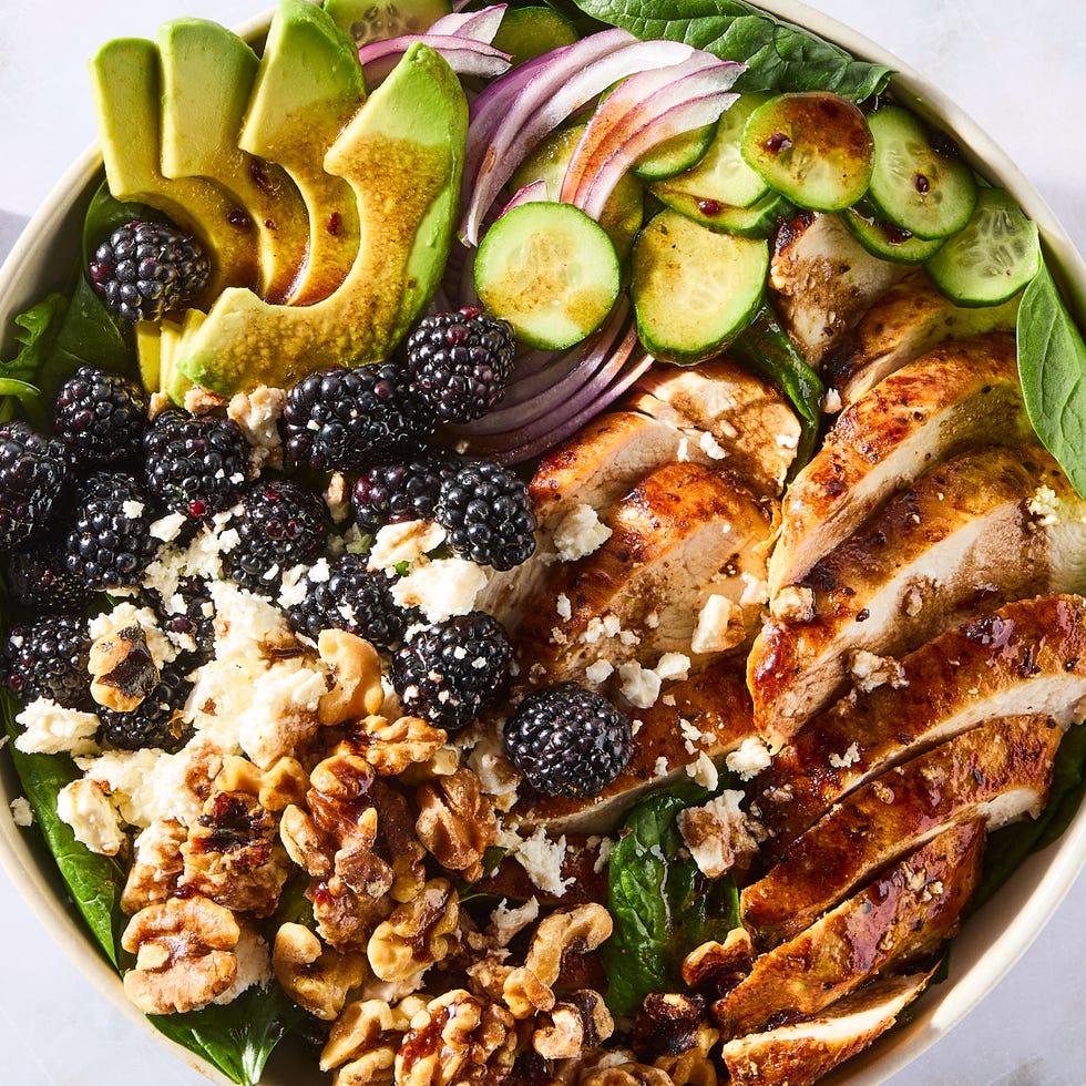 Blackberry Chicken Salad salad with sliced chicken, blackberries, sliced cucumber, red onion, and walnuts