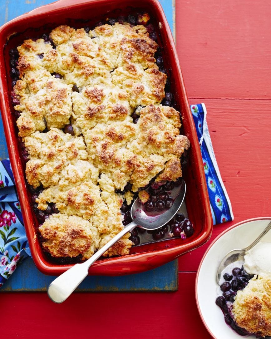 blueberry desserts blueberry cobbler blueberry cobbler on red wood surface