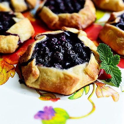 blueberry desserts mini blueberry galettes mini blueberry galettes on floral plate