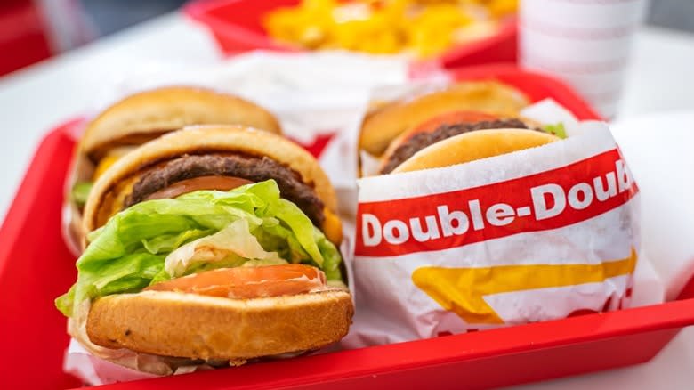 Two In-N-Out burgers on a red tray