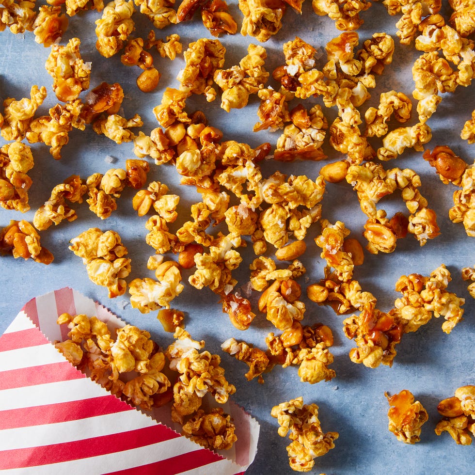 caramel sauce, honey, and roasted peanuts get tossed with popcorn and baked until crisp and crunchy