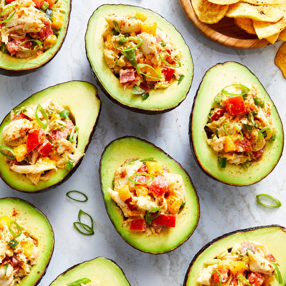 Crab Stuffed Avocado ripe avocado stuffed with chili and cumin spiced lump crab, tomato, mango, and scallion, served with plantain chips