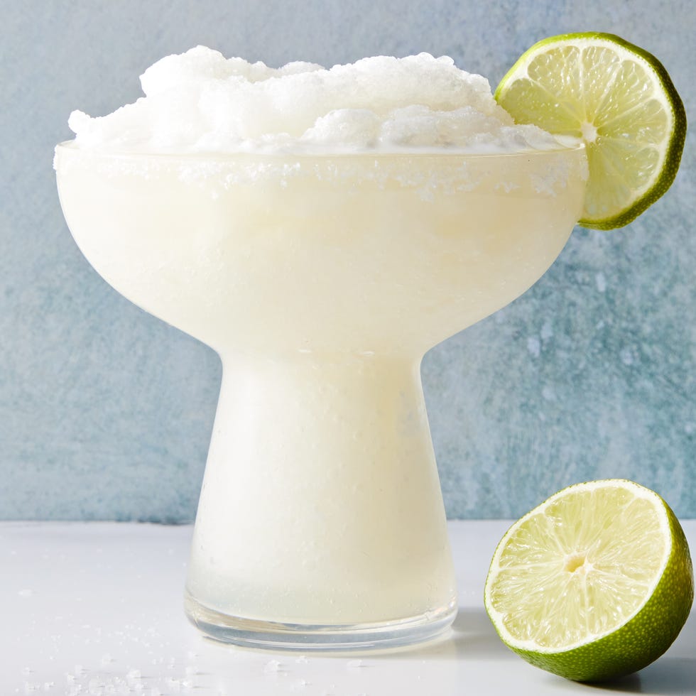 Frozen Margarita frozen margarita with a salt rim and lime wedge