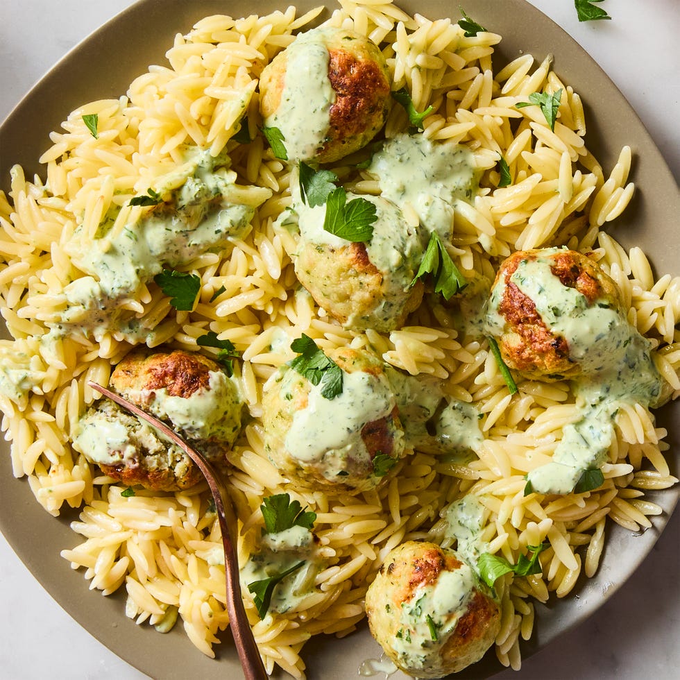 Green Goddess Meatballs meatballs served on top of orzo with creamy green goddess dressing