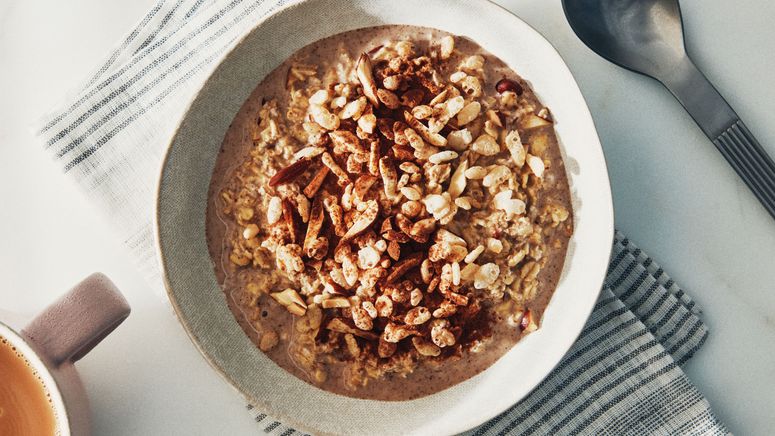 Hortchata overnight oatmeal in a bowl topped with rice crispys and cinnamon.