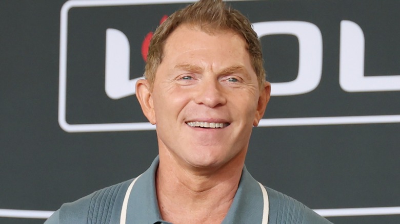 Bobby Flay poses on the red carpet