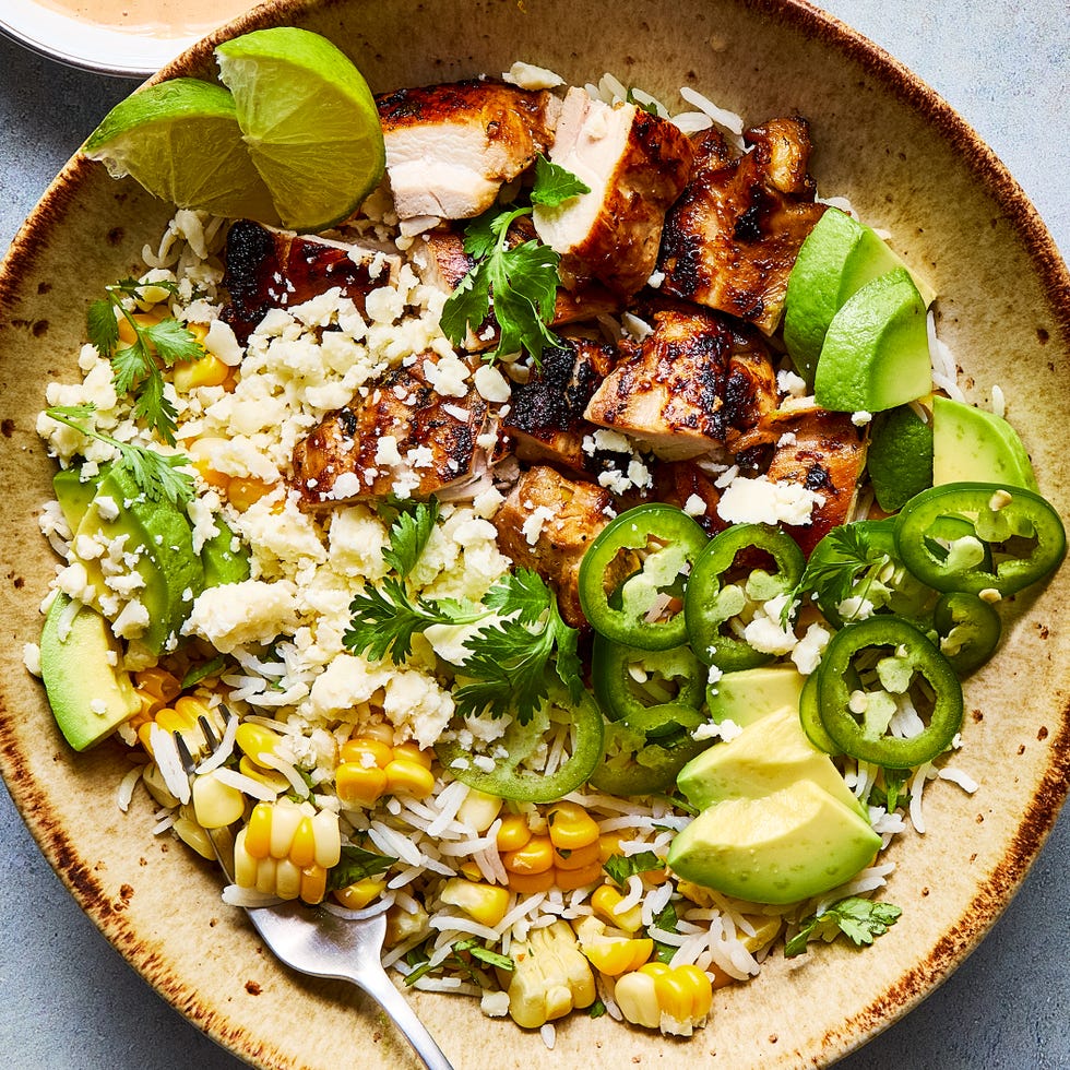Mexican Corn & Chicken Bowl rice bowl filled with chicken, corn, avocado, and jalapeno slices