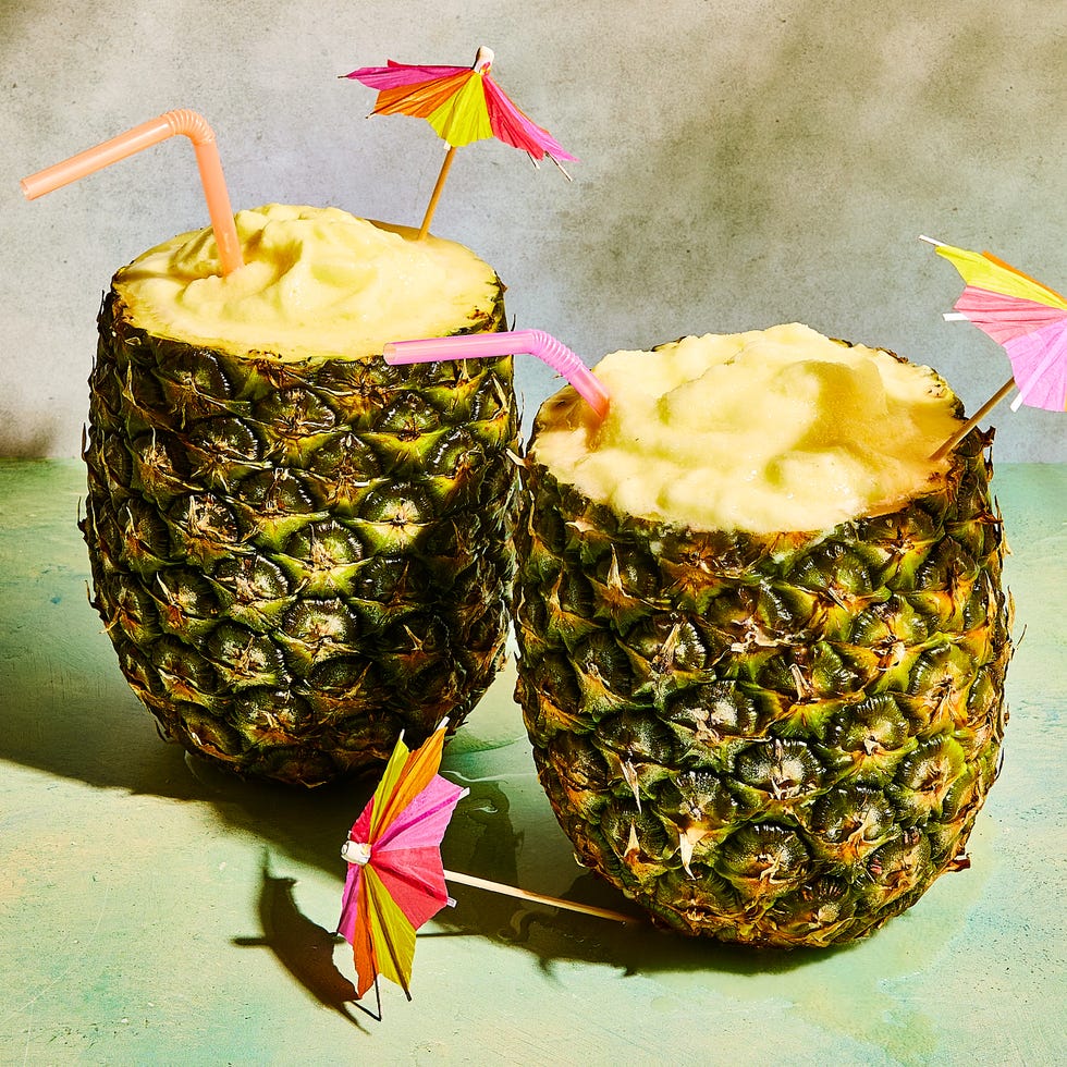 Pineapple Coladas pineapple pina coladas in a pineapple with umbrellas