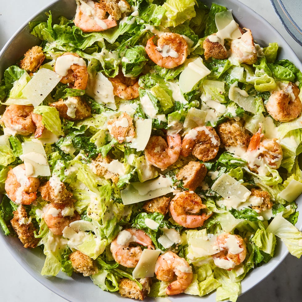Shrimp Caesar Salad horseradish marinated seared shrimp, crisp romaine, salty shaved parm, and crunchy homemade sourdough croutons tossed in a creamy, cheesy umami packed dressing
