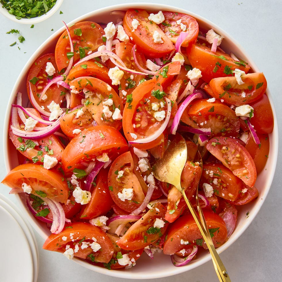 Tomato Salad sliced tomatoes with red onions and feta and herbs