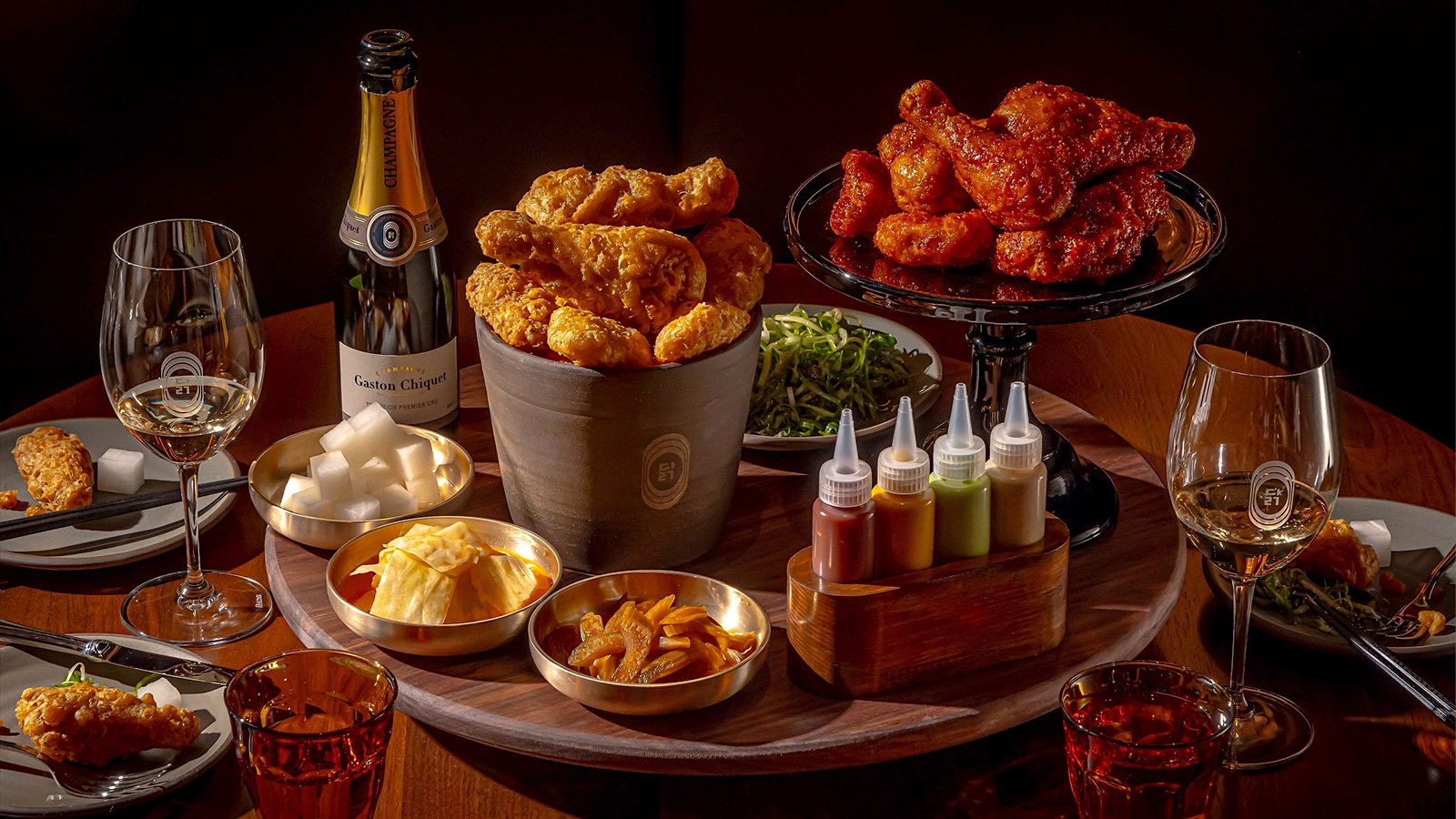 Cocodaq's buckets of fried chicken, in two styles, accompaniments and a bottle of Champagne with two glasses