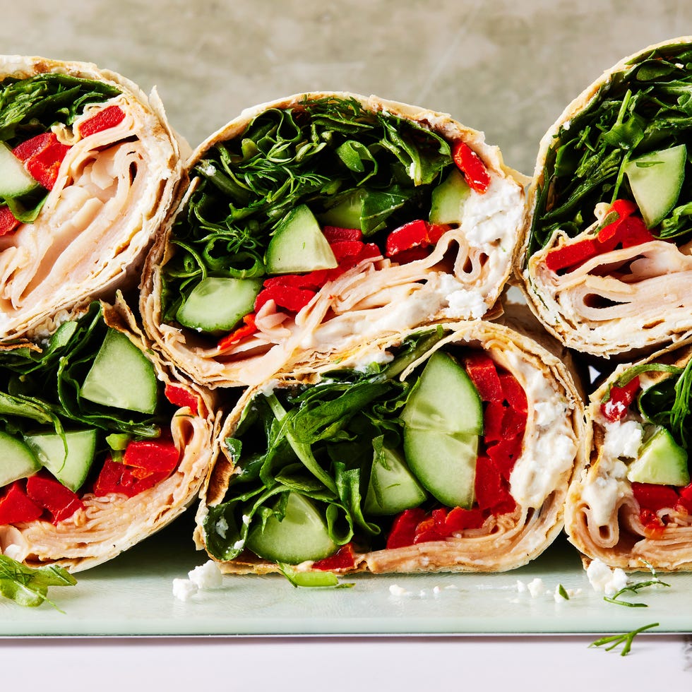 Turkey Lavash Wrap wrap filled with turkey, spinach, avocado, red peppers, and a goat cheese spread