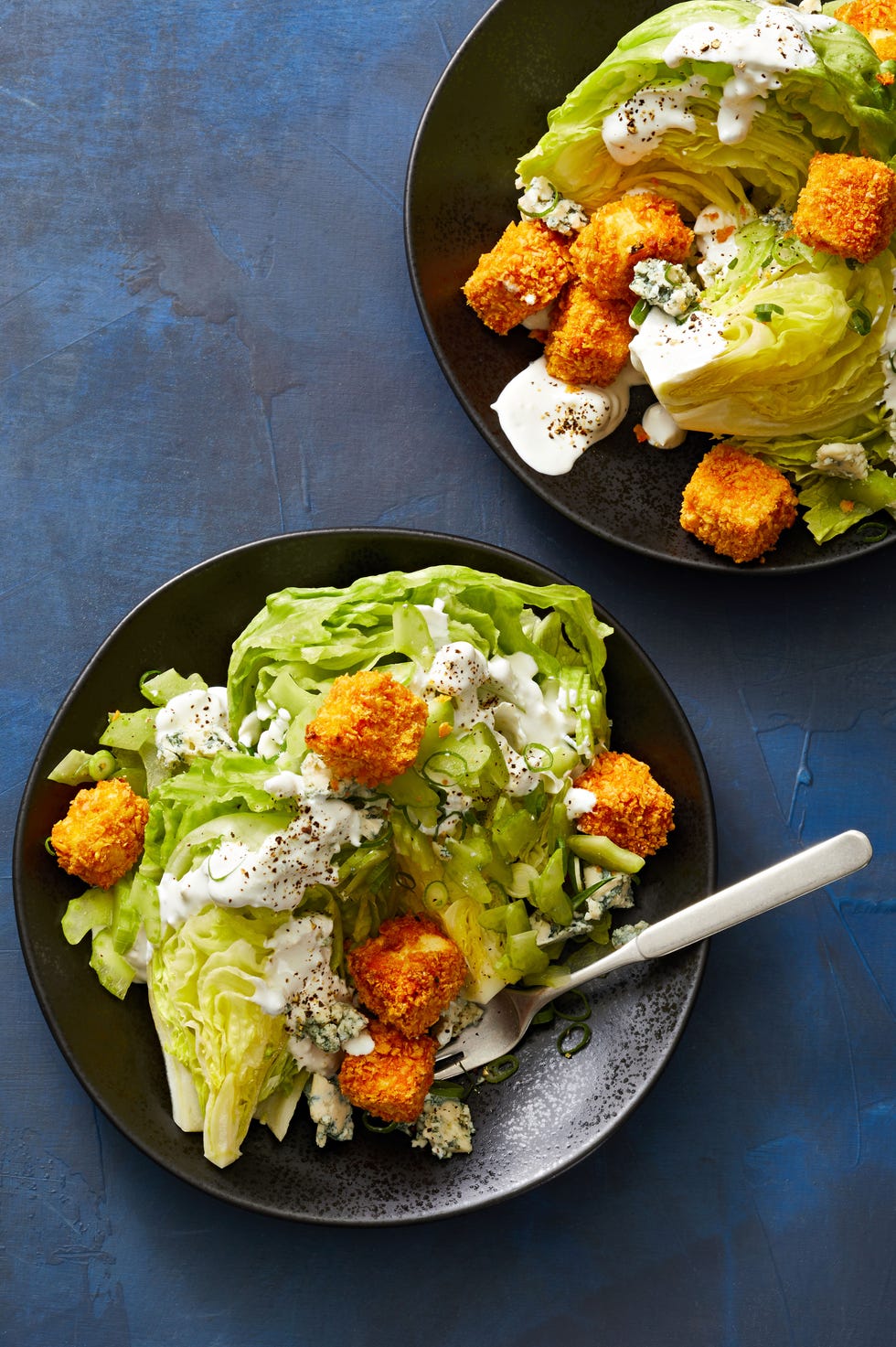 wedge salad with buffalo tofu croutons on top