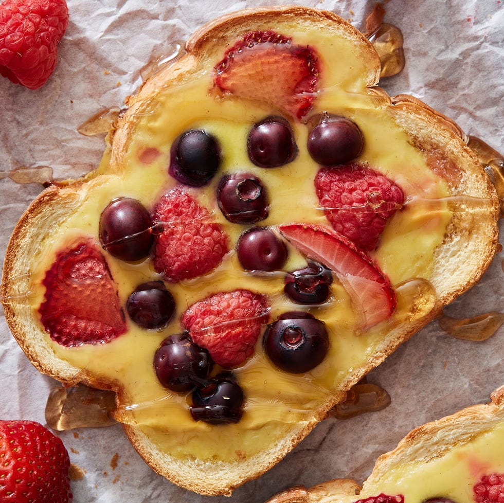 yogurt toast topped with berries and maple syrup