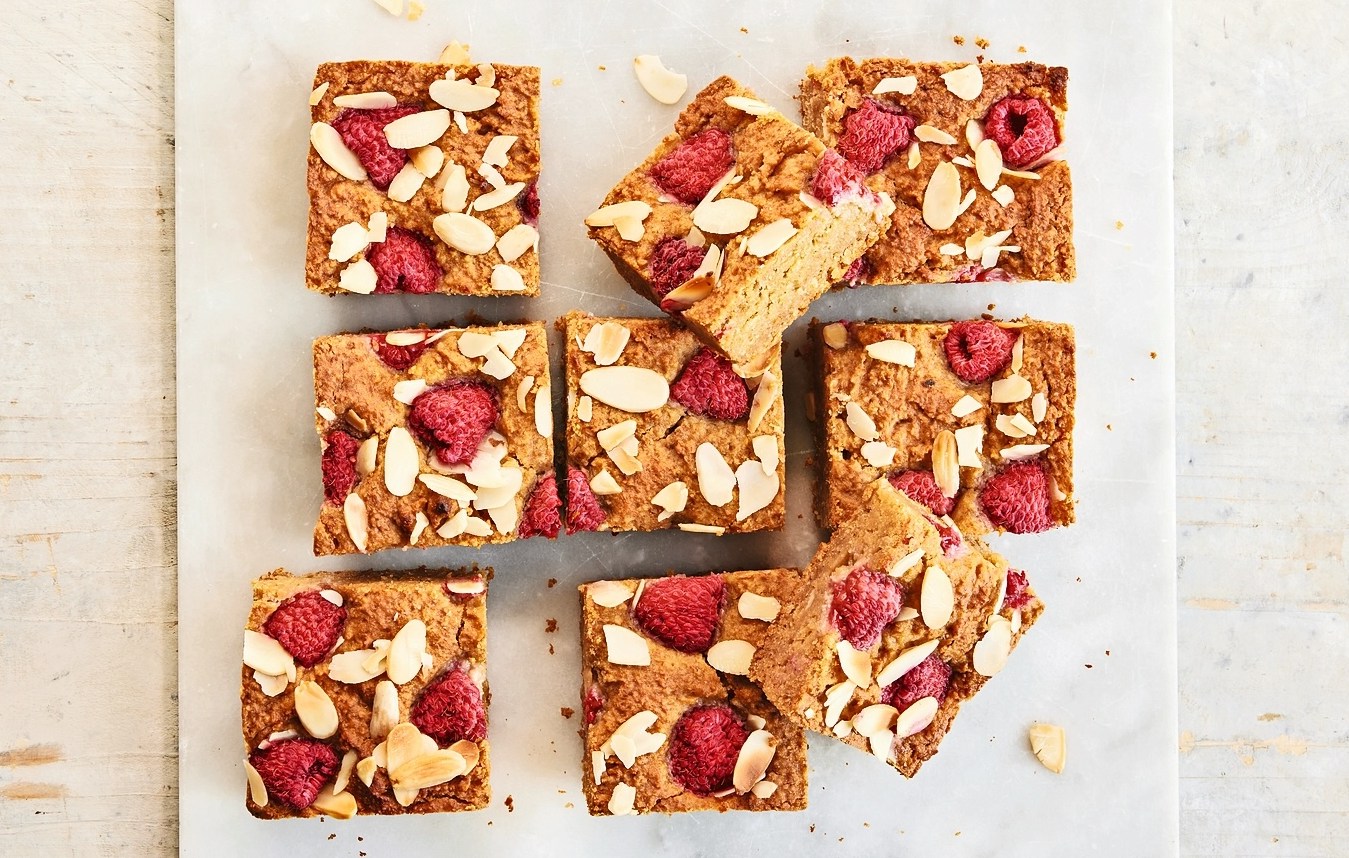Raspberry and almond blondies cut into squares.
