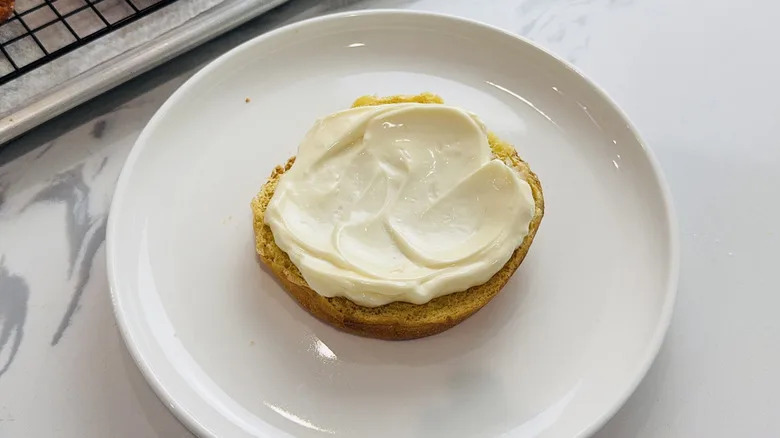 mayo spread on halved bread bun