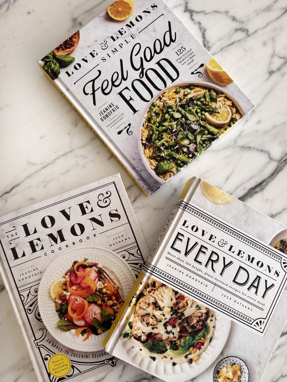 Three cookbooks arranged on a marble surface