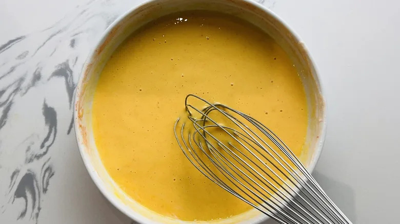 whisking egg and buttermilk mixture