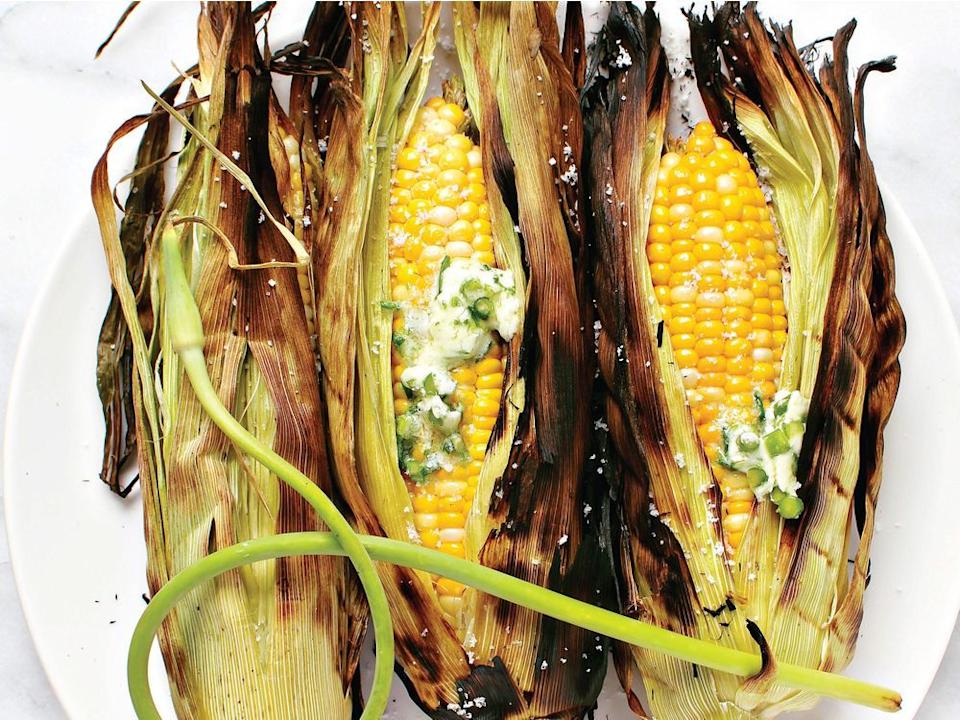 A turn on the grill adds a smoky accent to Lindsay Anderson and Dana VanVeller¹s barbecued corn on the cob with chives and garlic butter.