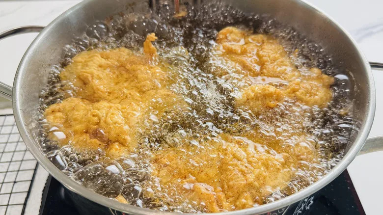 frying chicken thighs in large pot