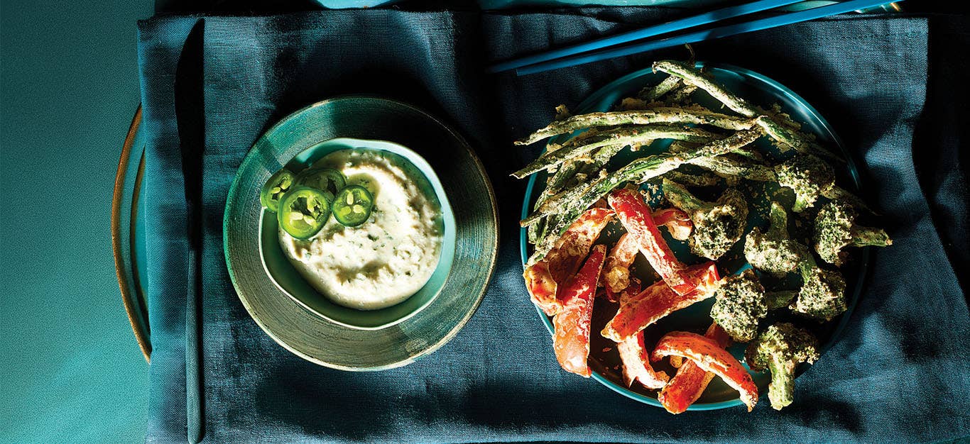 Air-Fried Tempura Veggies on a plate next to a small bowl of Jalapeño-Lime Sauce