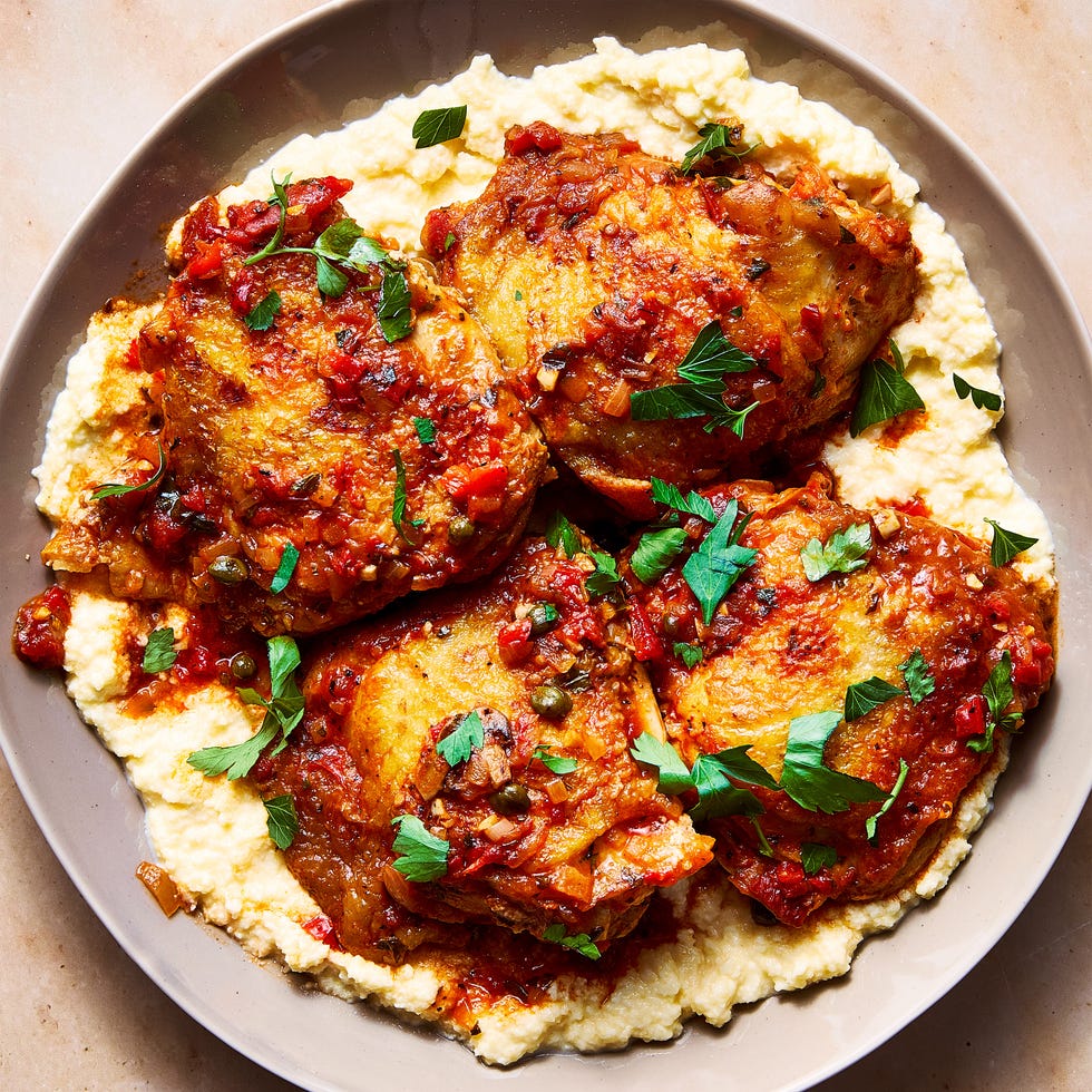 Chicken Cacciatore chicken in a tomato sauce over polenta