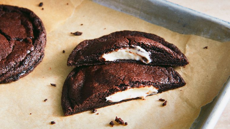 a brownie cut in half on baking sheet