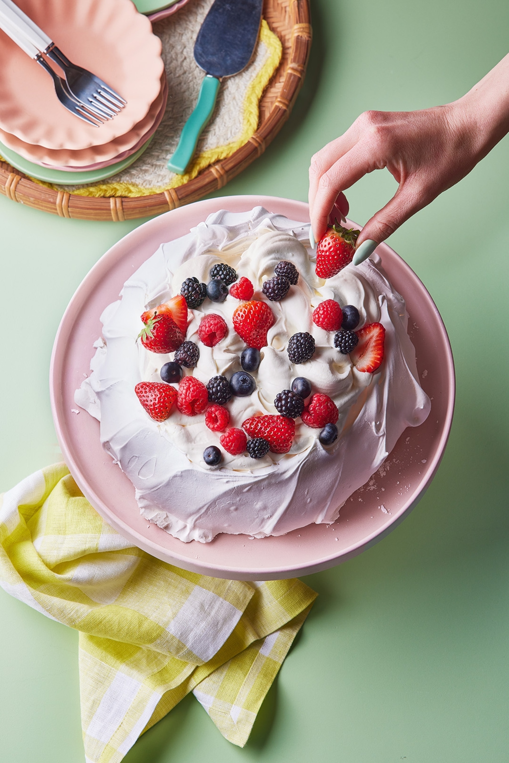 shot of pavlova in its final form with fruit on top