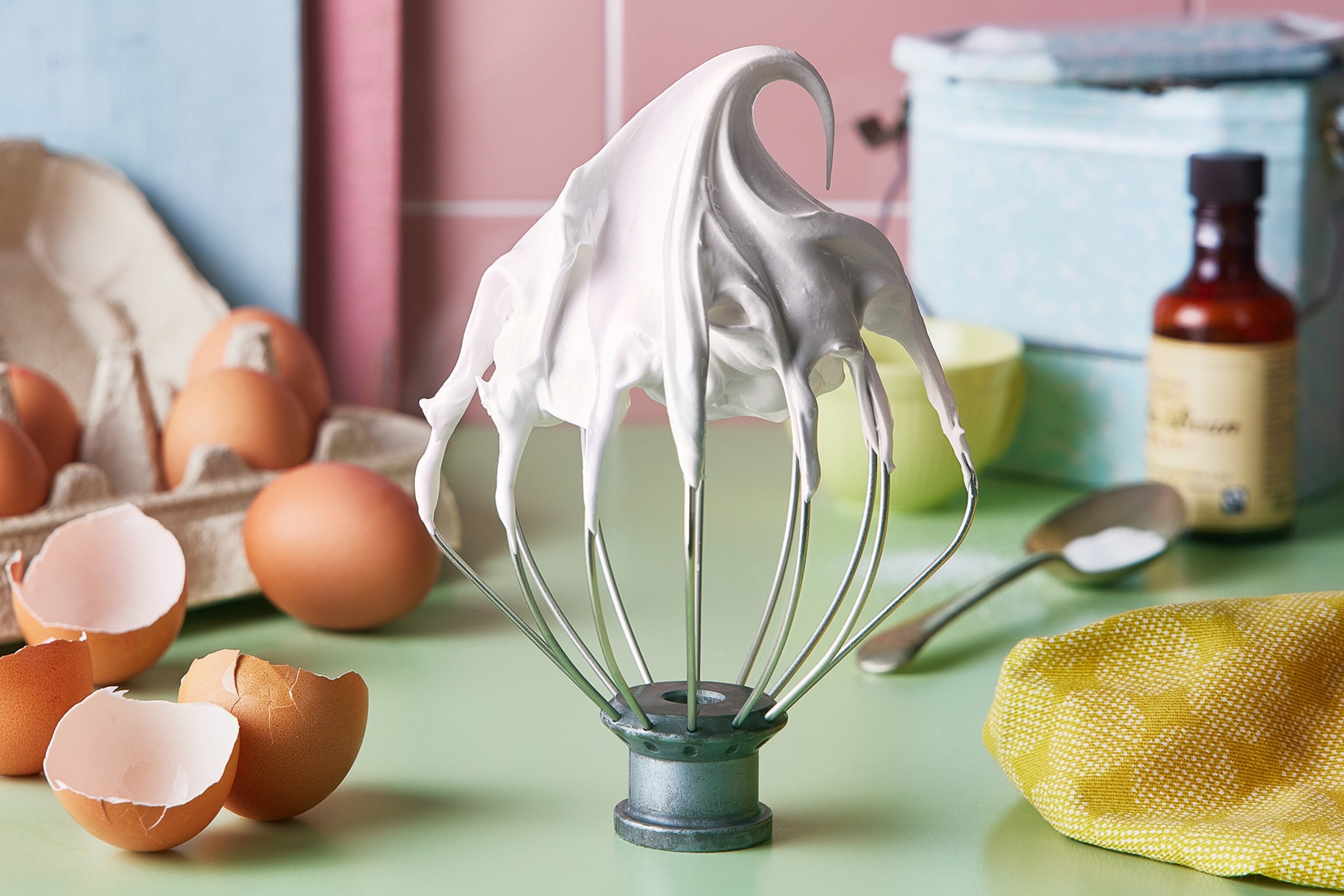 photo of a whisk with meringue