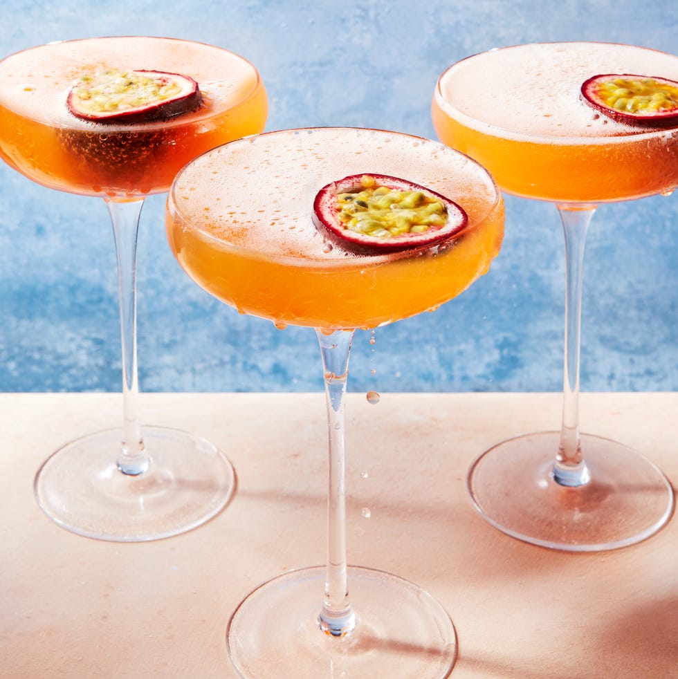 orange passion fruit martini garnished with a passionfruit