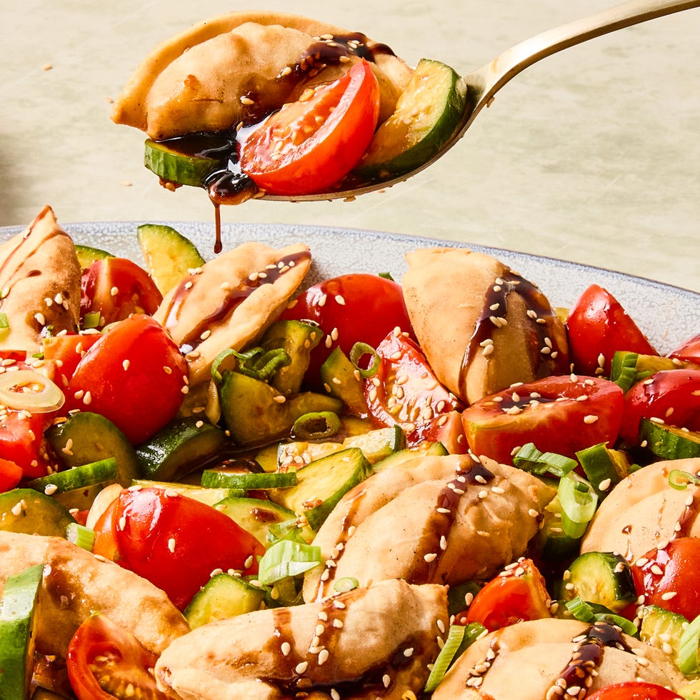 deep fried dumplings tossed with soy and chili marinated tomatoes and cucumbers