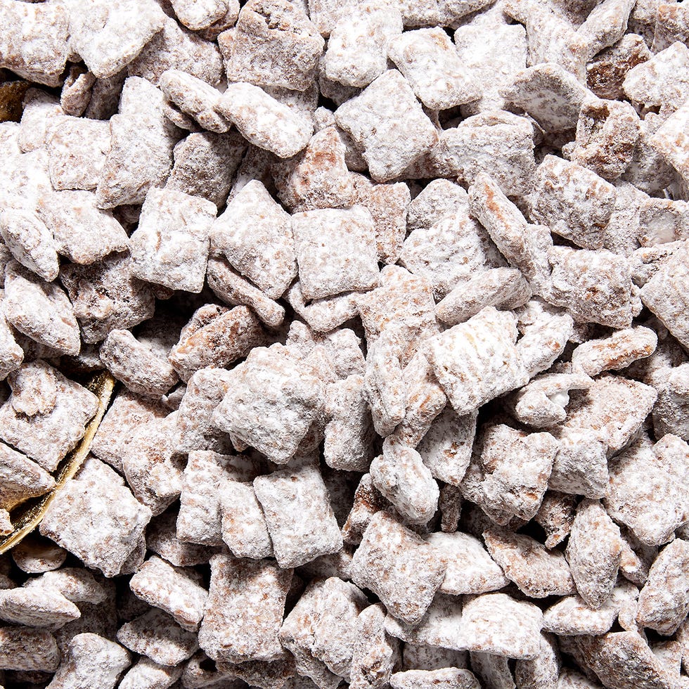 Puppy Chow chex mix tossed in peanut butter and powdered sugar