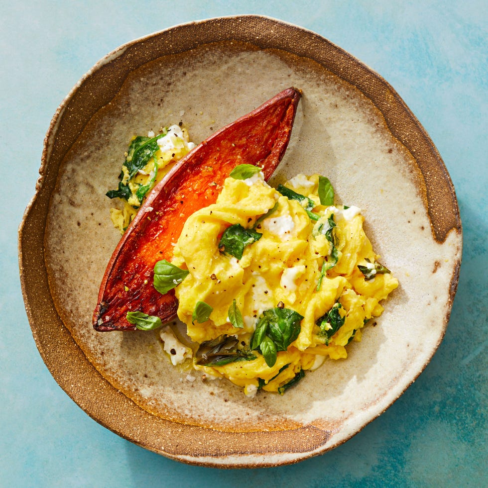 soft scrambled eggs with spinach on sweet potatoes