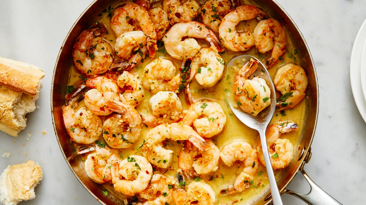 fried shrimp tossed in sauce and garnished with green onions