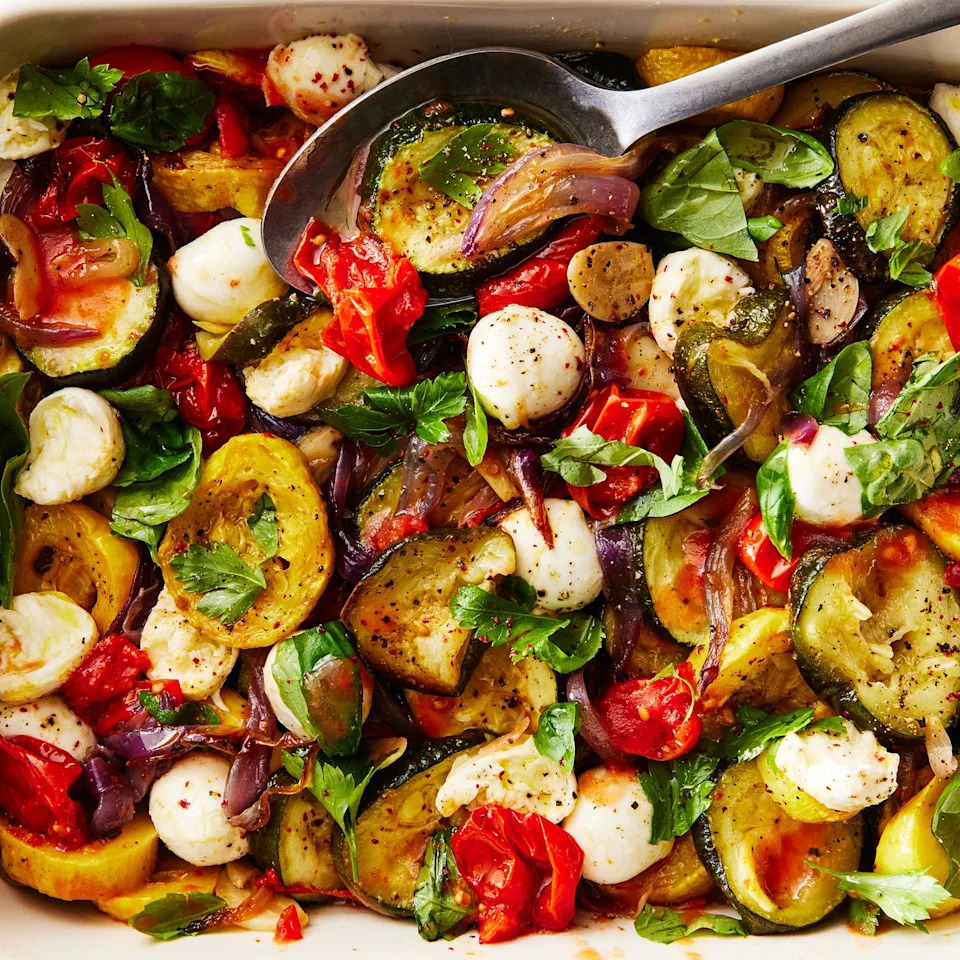 mixed summer vegetable ragú in a white pan