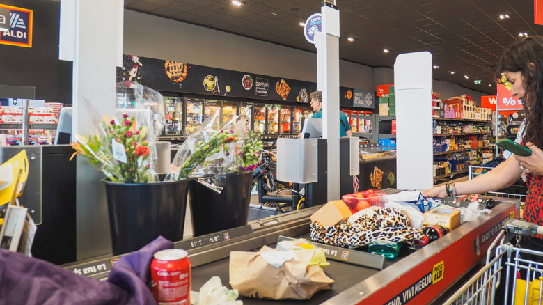 shopper checking out at Aldi