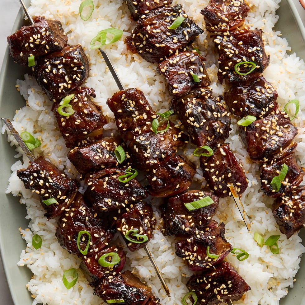 marinated pieces of sirloin steak in soy and chili garlic sauce, skewered with red onion, and brushed with a sweet and savory honey garlic glaze