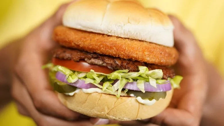 Hands holding Culver's CurderBurger