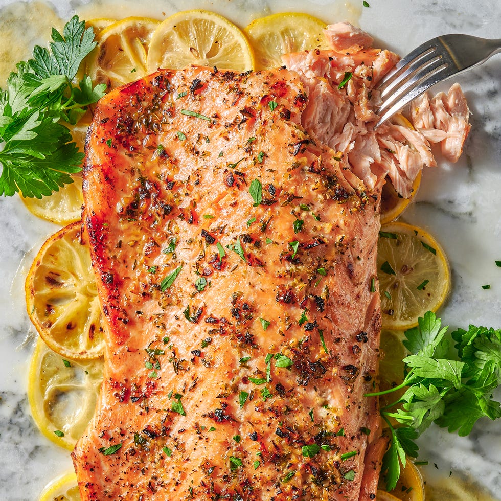 Baked Salmon baked salmon with lemon slices and herbs